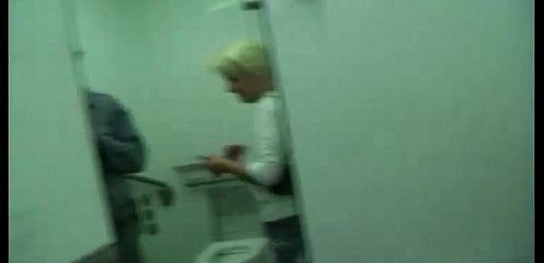  She gives a blow job in a public toilet!